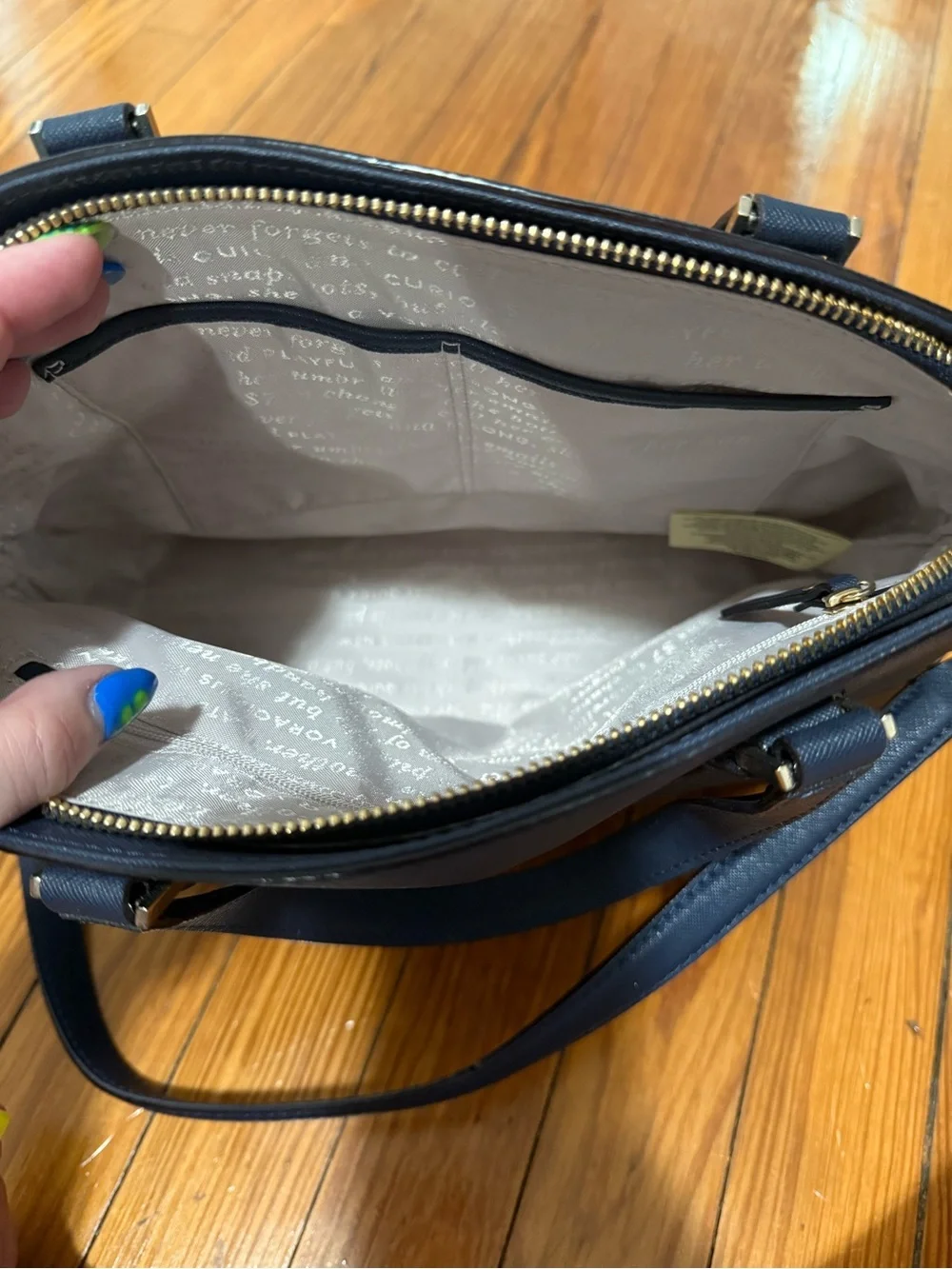 kate spade navy satchel with blue floral appliqué